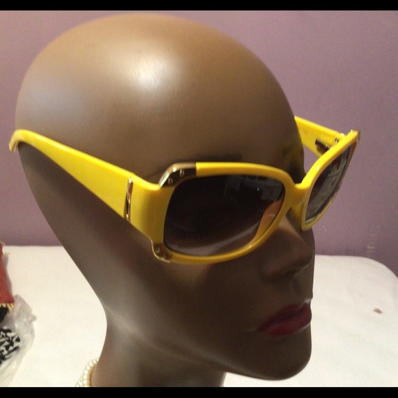 2 pairs of yellow and hot pink sun glasses. - Picture 4 of 9